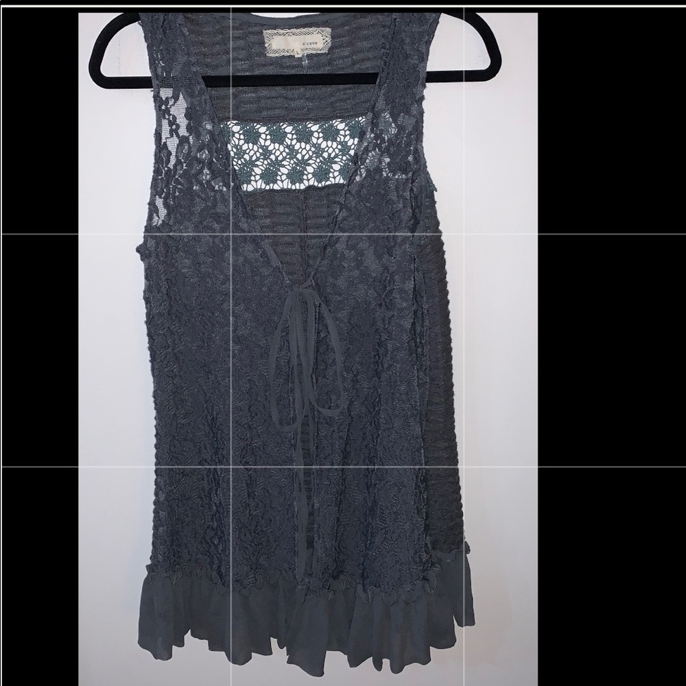 Long crocheted sweater with tie closure.